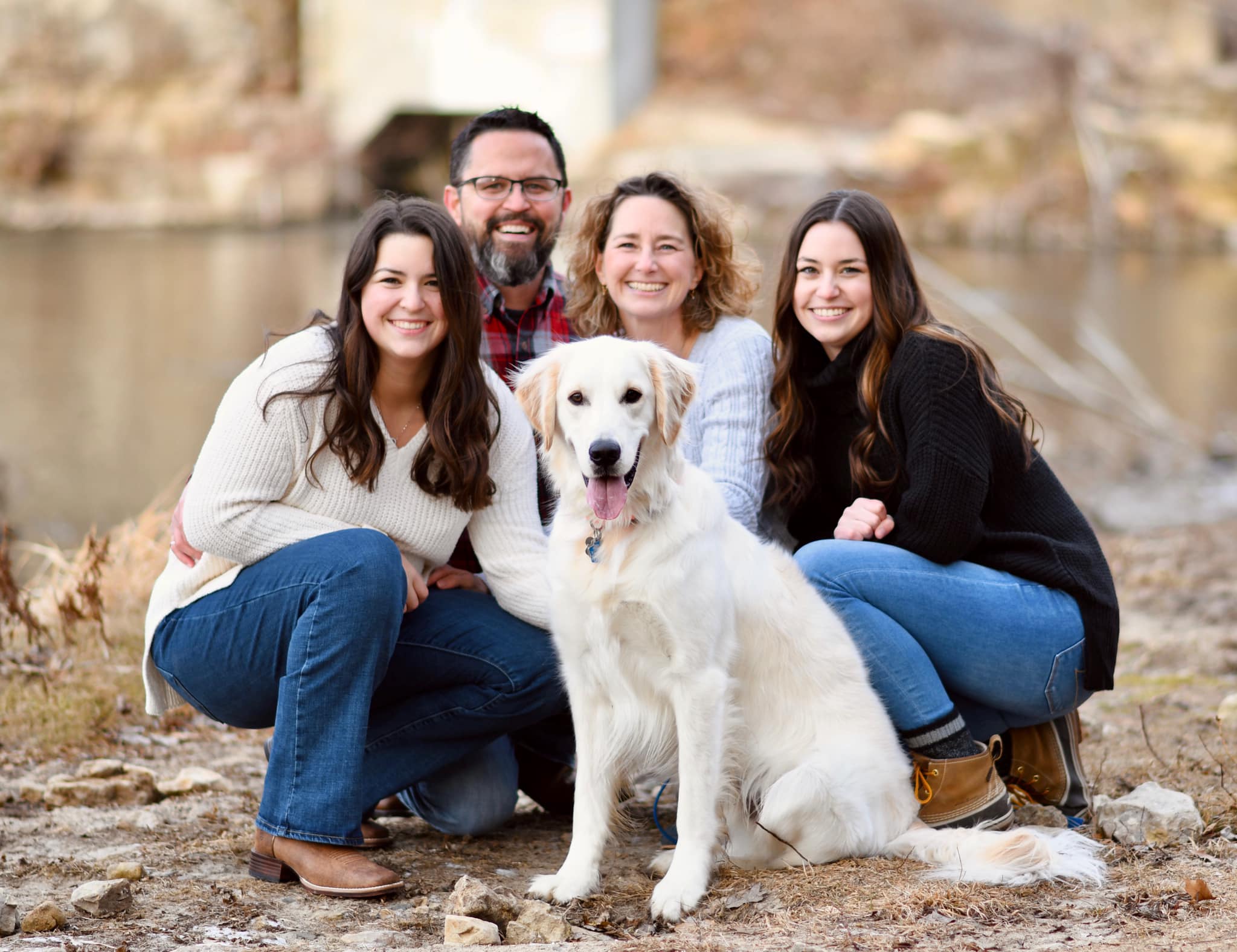 Brandi with her husband Jason, daughters Madeline and Allison, and Ramsey by the river
